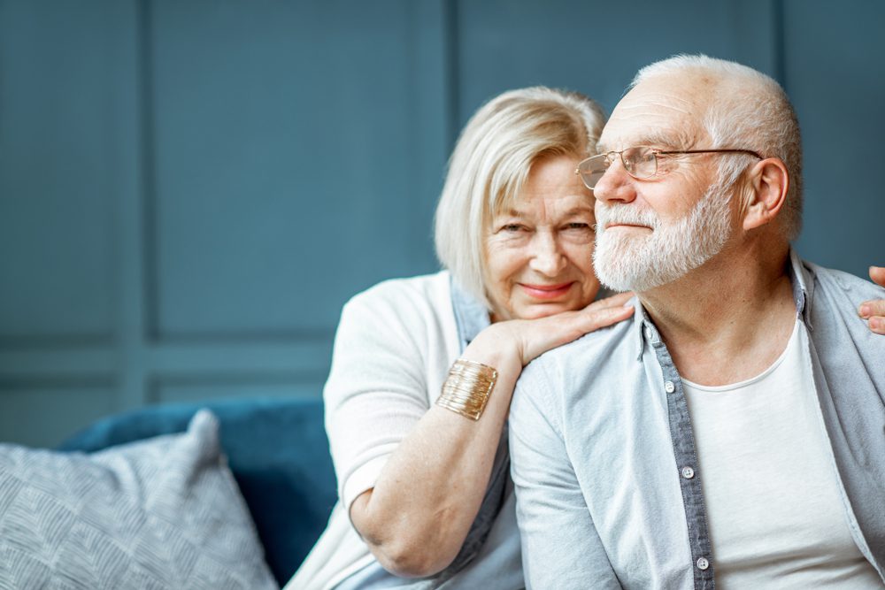 Portrait,Of,A,Beautiful,Senior,Couple,Embracing,Each,Other,,Sitting