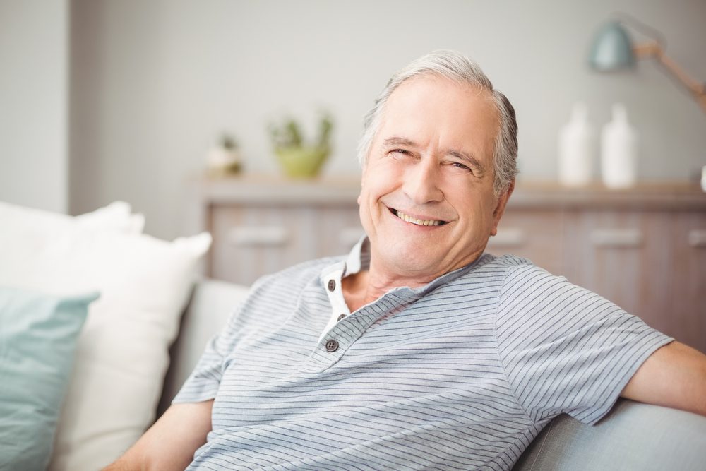 Portrait,Of,Happy,Senior,Man,Smiling,At,Home