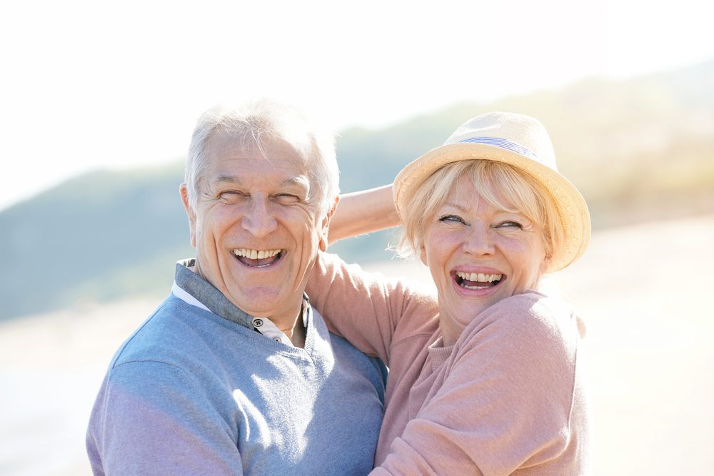 Portrait,Of,Senior,Couple,At,The,Beach