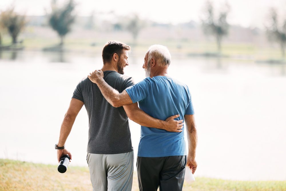 Back,View,Of,Happy,Athletic,Man,And,His,Senior,Father