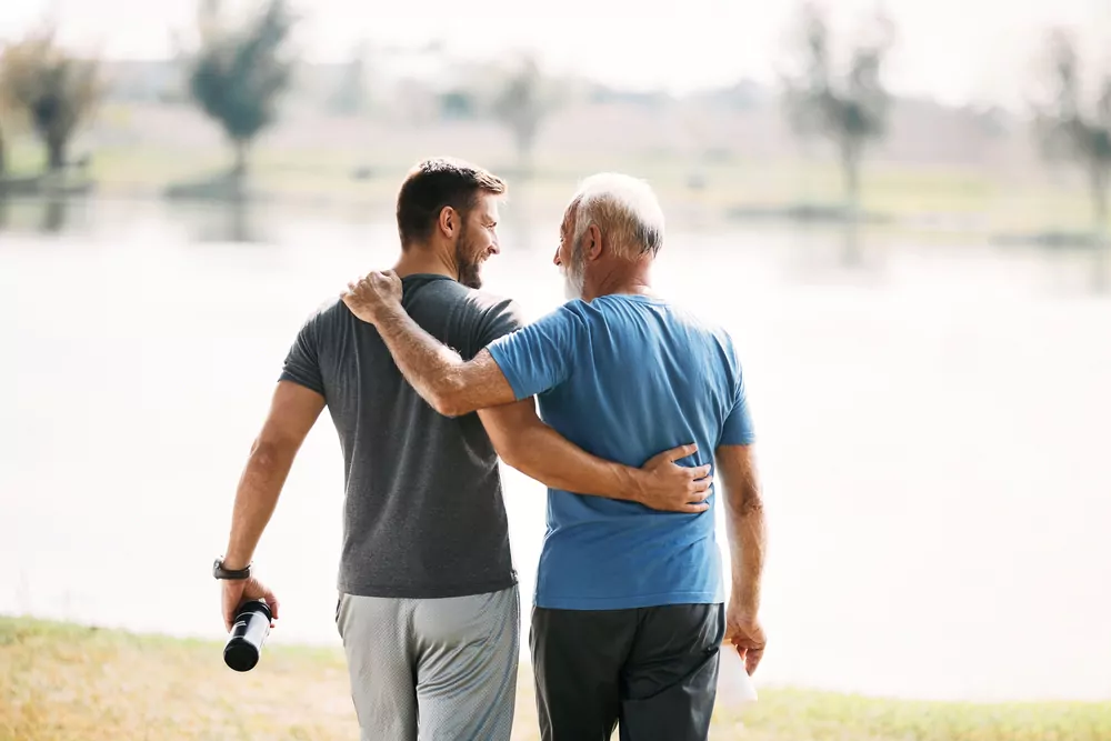 Back,View,Of,Happy,Athletic,Man,And,His,Senior,Father