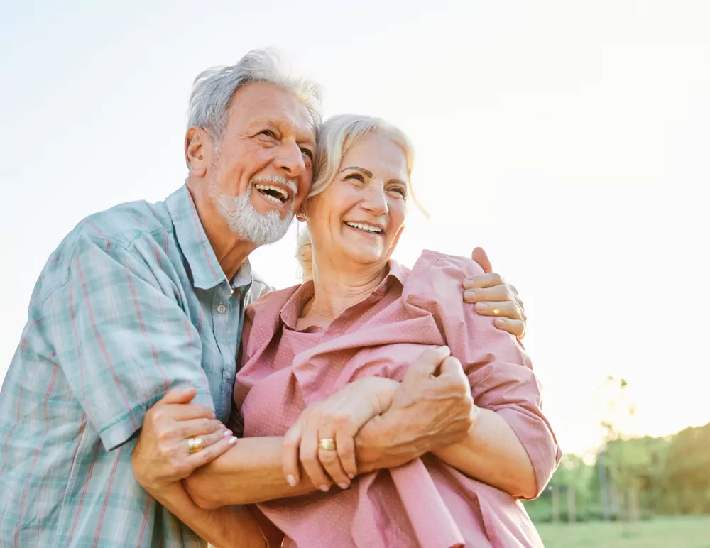 Happy,Active,Senior,Couple,Having,Fun,Talking,And,Hugging,In